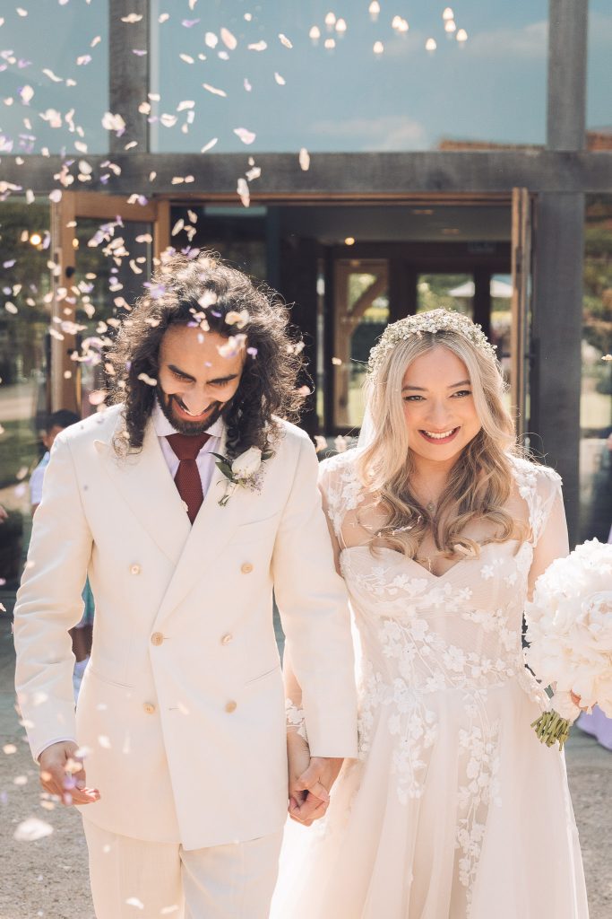 Bride and groom with confetti